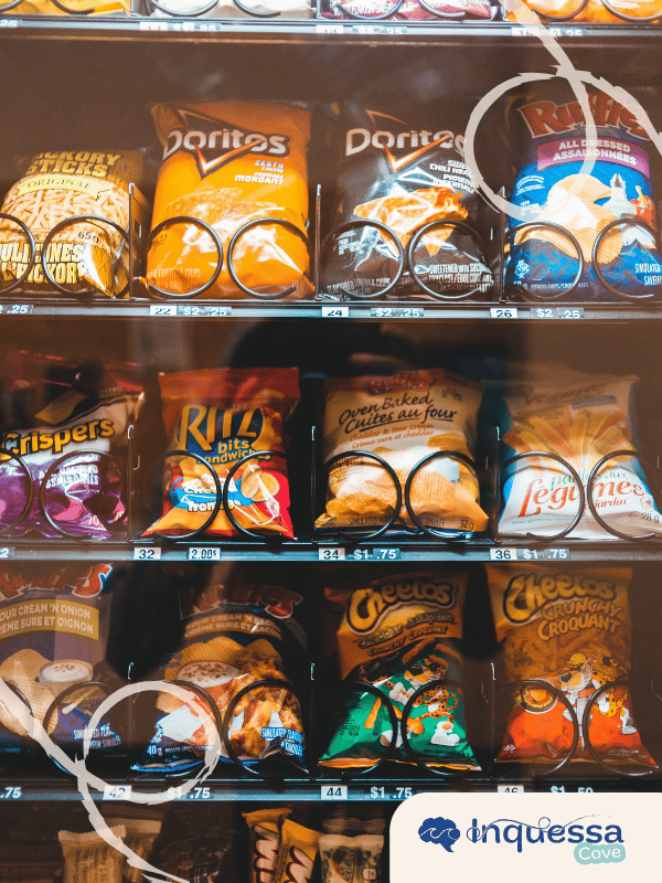 Rows of packaged snack foods in colorful plastic bags on store shelves