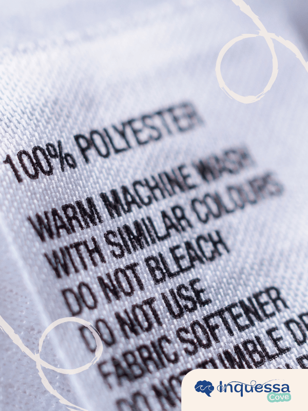 Close-up of a clothing label marked 100 percent polyester