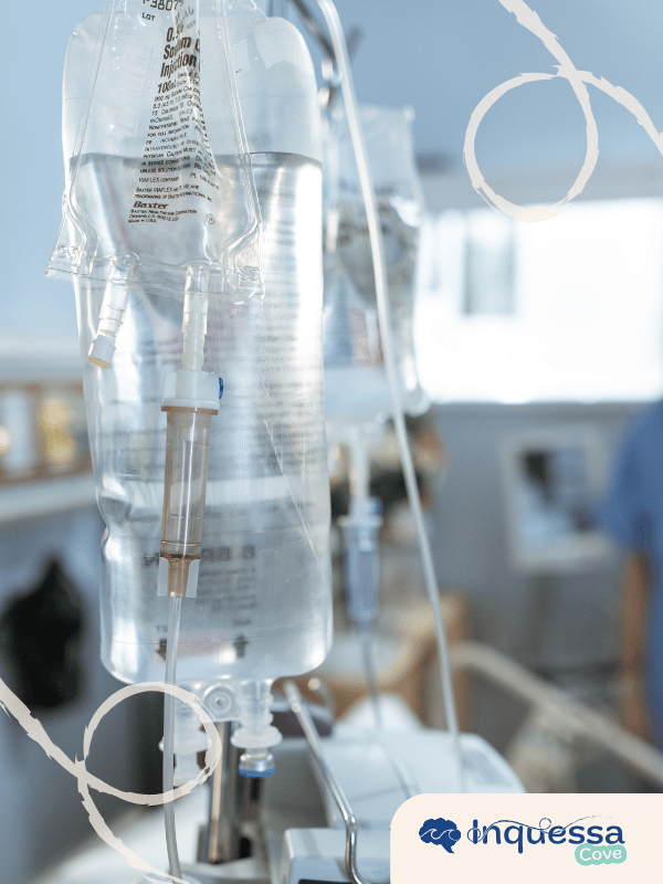 Clear plastic IV fluid bags hanging in a medical setting