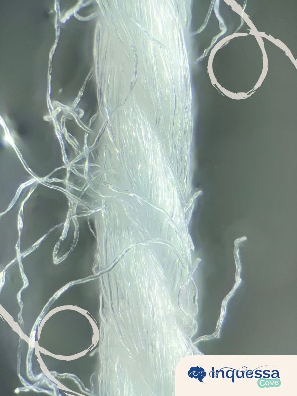 Close-up of frayed white synthetic fibers