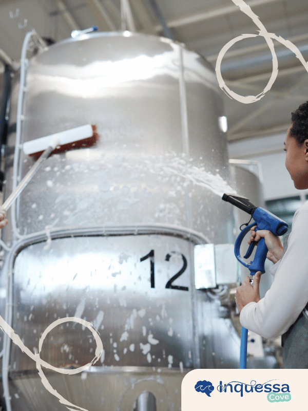 Large industrial tank being cleaned with water